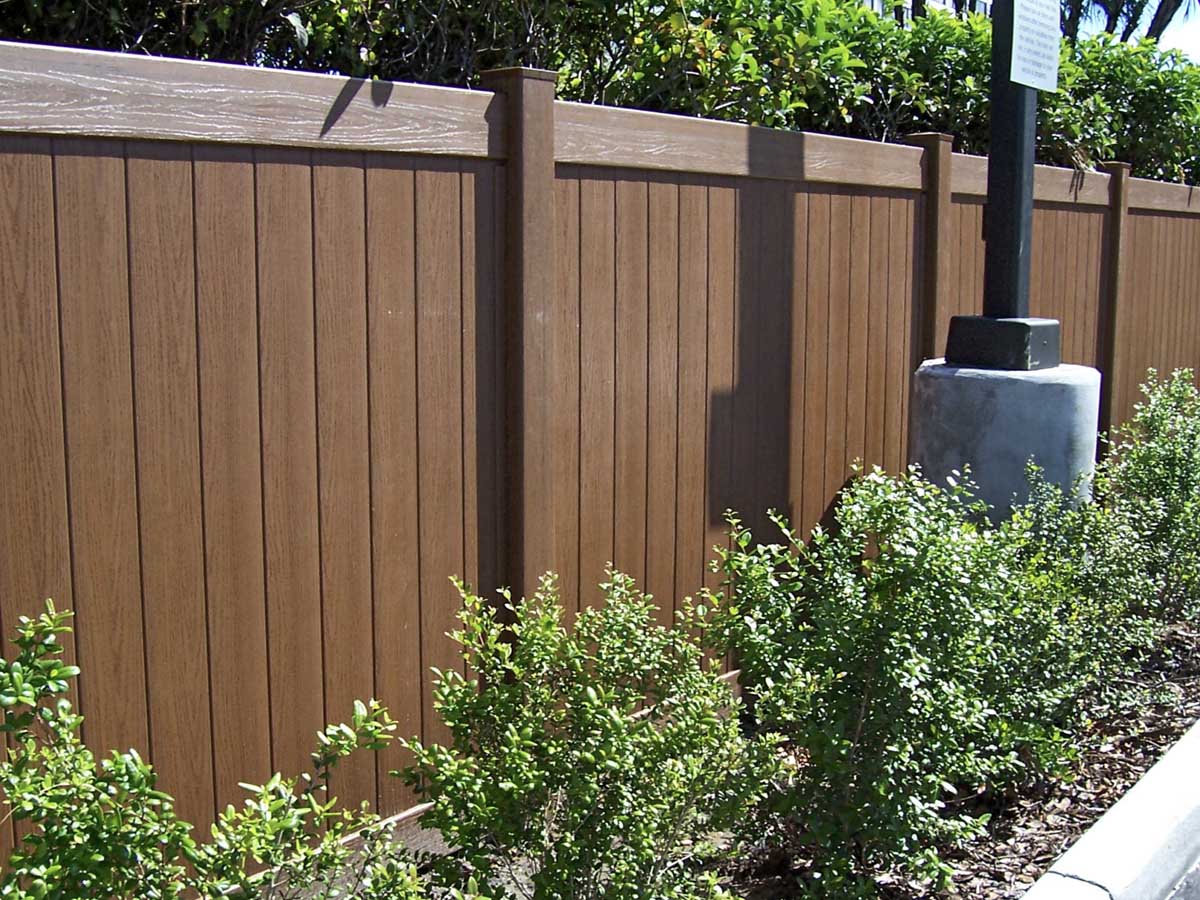 Wood-Grain Vinyl Privacy Fence Installed at Commercial Property Line – Maintenance-Free Option in Cincinnati, OH