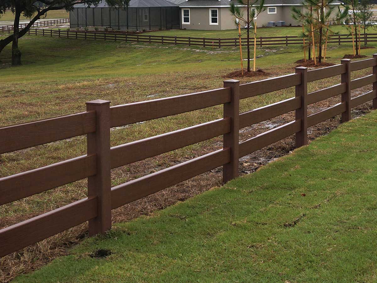 Three-Rail Ranch-Style Vinyl Fence in Wood Tone – Ideal for Large Residential Properties in Cincinnati, OH